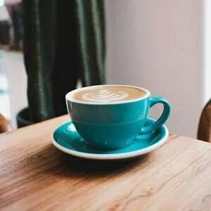 Flat White coffee pour in a coffee cup