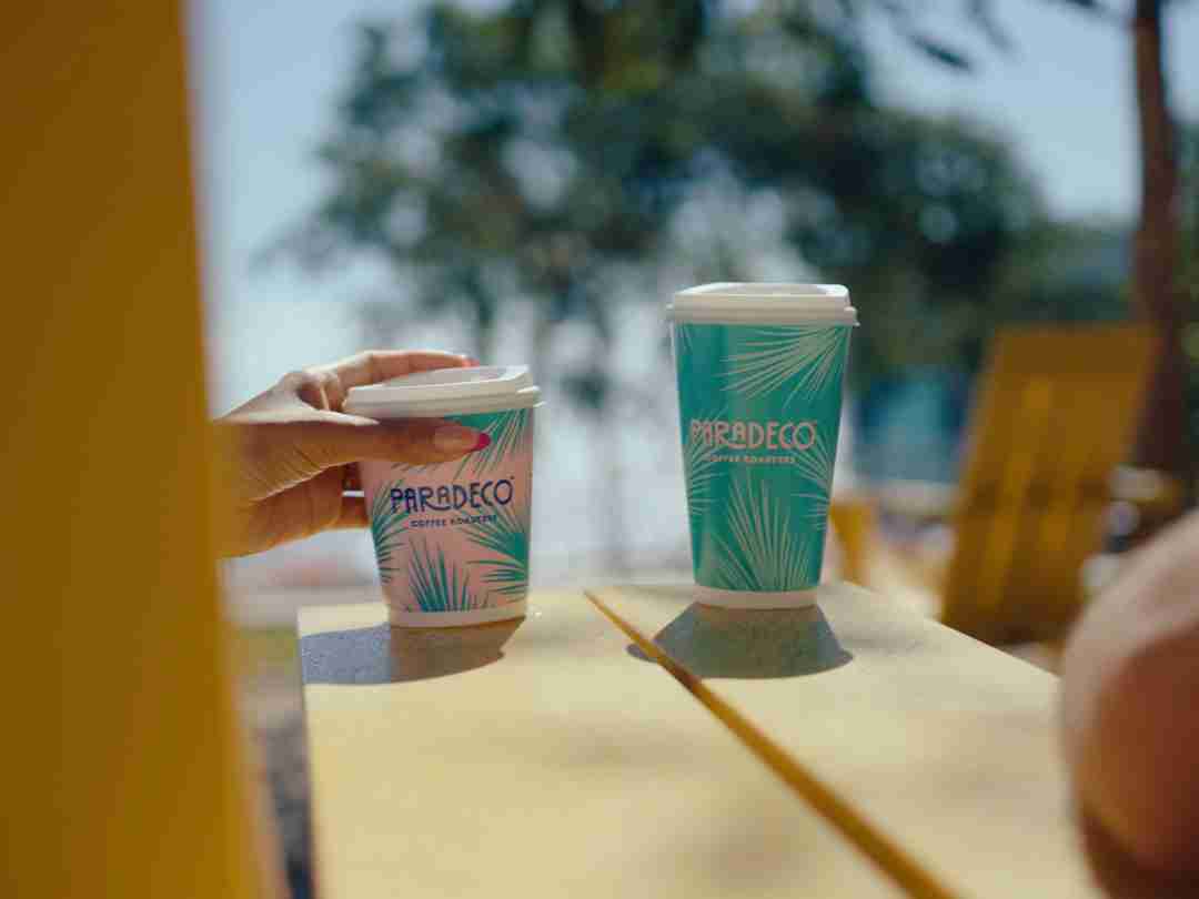 Favorite Coffee Shop's 2 different sized cups of Paradeco coffee or tea beverages, out and about in St. Petersburg Florida